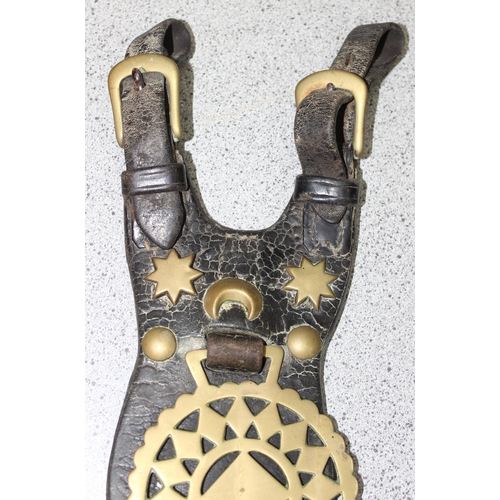 1798 - Qty of antique and later horse brasses and adornments, mostly on leather straps