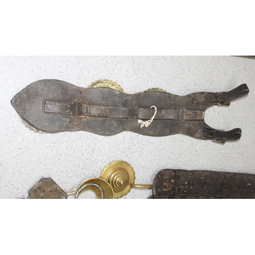 1798 - Qty of antique and later horse brasses and adornments, mostly on leather straps