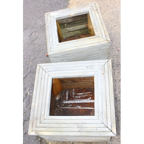 325 - Pair of wooden garden planters, approx 55cm W x 53cm D x 40cm H