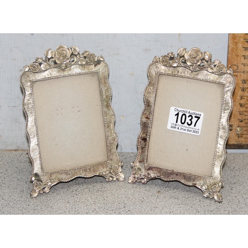 1037 - A pair of silver-plated photo frames with rose decoration, approx 16cm x 10cm