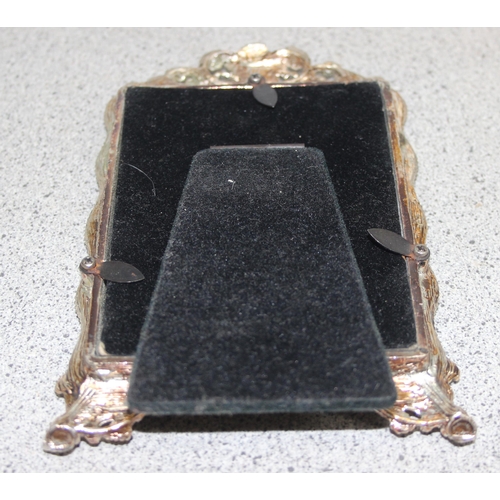 1037 - A pair of silver-plated photo frames with rose decoration, approx 16cm x 10cm