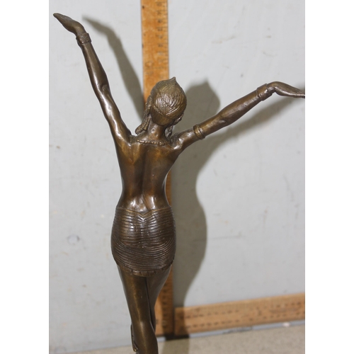 1631 - In the manner of Demitri Chiparus, an Art Deco style bronze figure formed as a dancing lady on marbl... 