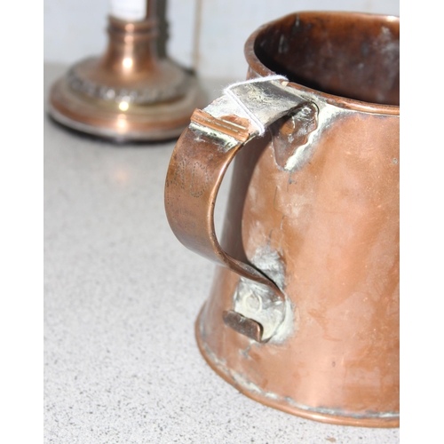 1750 - Large antique copper tankard and a pair of weighted copper candlesticks (approx 20cm tall)