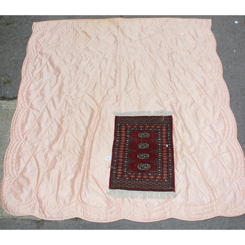 201 - Small red-ground Afghan rug (approx 87cm x 60cm), and a large vintage peach coloured throw (2)