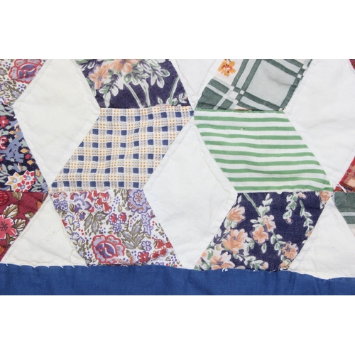 202 - A large vintage patchwork quilt, approx 240cm x 223cm