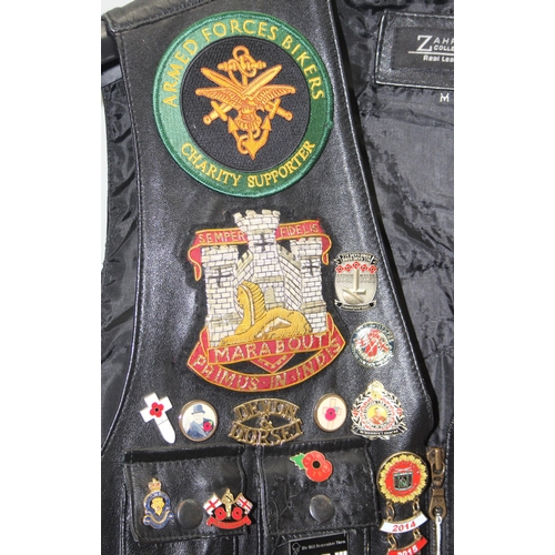 705 - Leather biker's waistcoat jacket by Zahra with adorned with Harley Davidson badges and patches among... 