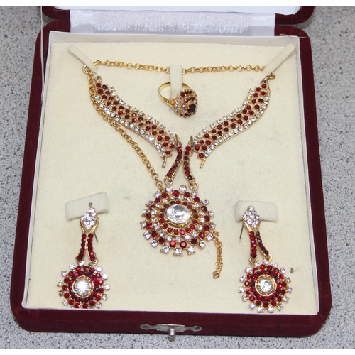 1128 - Indian 22ct gold plated four piece wedding  jewellery set in fitted case