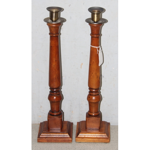 1764 - Pair of tall wooden turned column candlesticks with metal candle holders and drip trays, approx 43cm... 