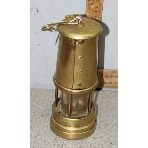 1765 - Ferndale solid brass coal mining lamp with wick and paraffin reservoir, approx 22cm tall, and a red ... 