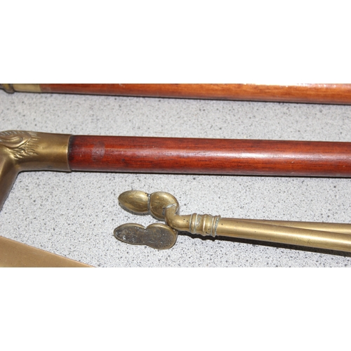 1767 - Art Deco brass three piece fire set - coal tongs, shovel, and poker approx 66cm long and a small bra... 