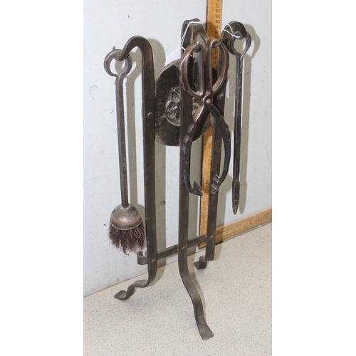 1768 - Hand forged iron three piece fire tool set on Tudor rose iron stand