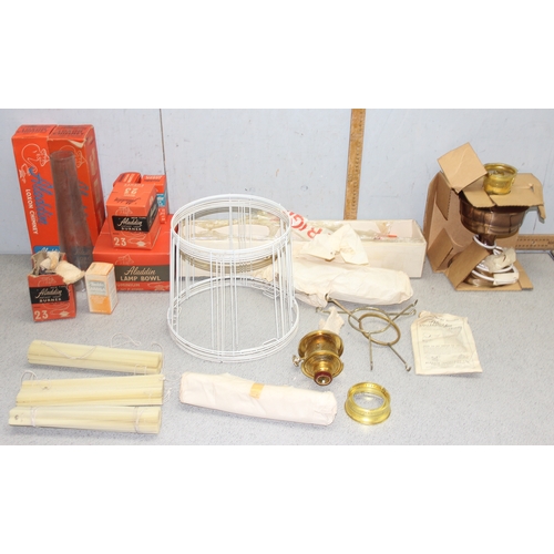 242 - A large qty of assorted oil lamp parts to inc chimneys, wicks etc, some pieces boxed