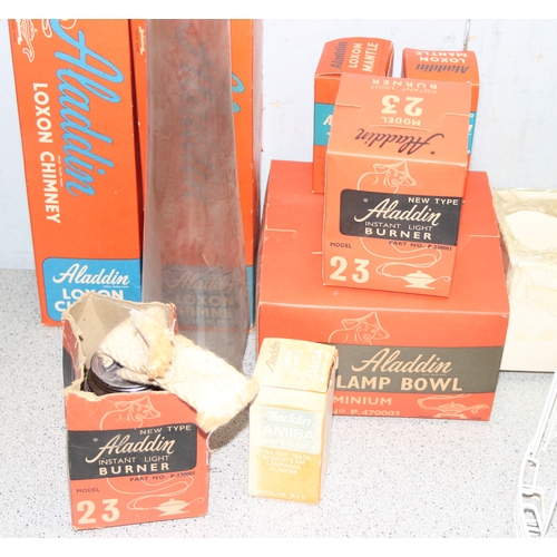 242 - A large qty of assorted oil lamp parts to inc chimneys, wicks etc, some pieces boxed