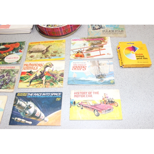 520 - A box of assorted tea cards, loose and in books, and some FDC stamps