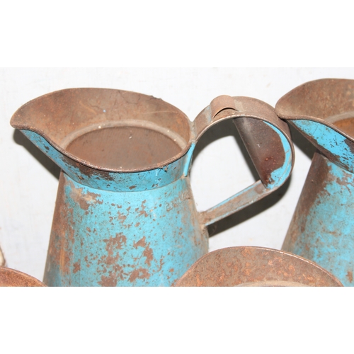 840 - 5 vintage metal oil pouring jugs