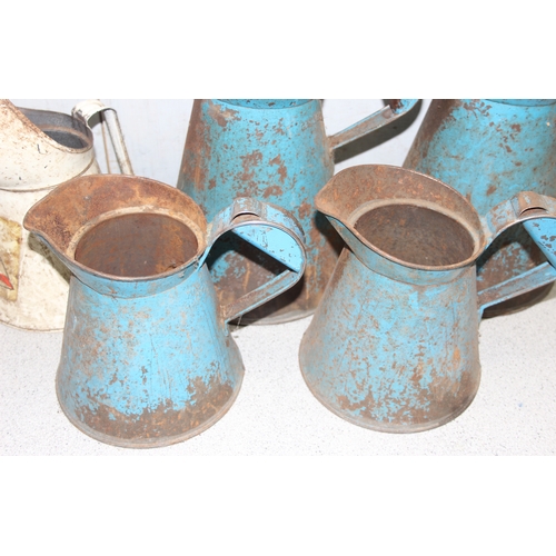 840 - 5 vintage metal oil pouring jugs