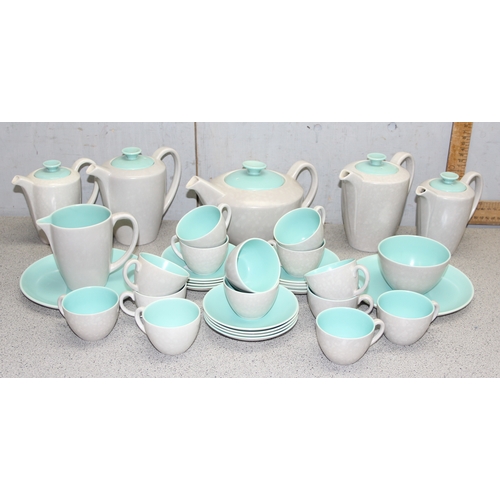 1779 - Large qty of mid-century Poole pottery, incl tea and coffee pots, cups, saucers and plates etc in th... 