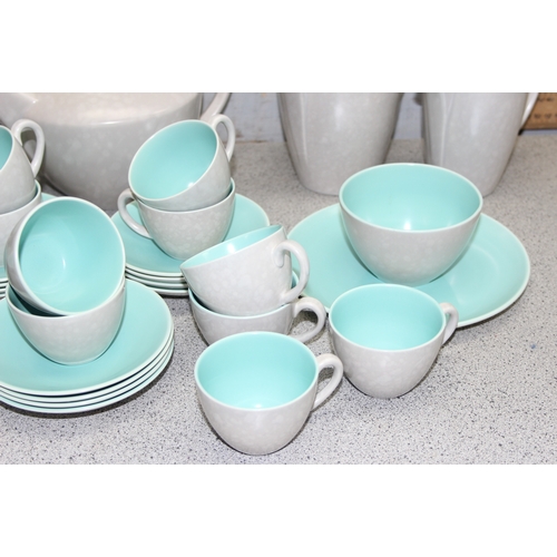 1779 - Large qty of mid-century Poole pottery, incl tea and coffee pots, cups, saucers and plates etc in th... 