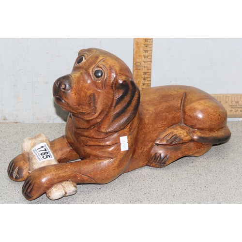 1785 - Carved wooden model of a dog with a bone, approx 39cm long