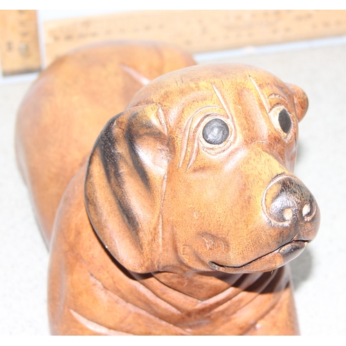 1785 - Carved wooden model of a dog with a bone, approx 39cm long