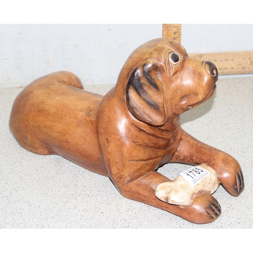 1785 - Carved wooden model of a dog with a bone, approx 39cm long