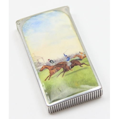 1001 - A Victorian silver and enamel vesta case by Sampson Mordan & Co, the front enamelled with a horse ra... 