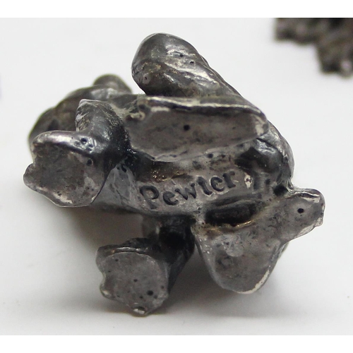 1004 - A miniature cast silver frog, London 1965 by DSP, approx 25mm wide and 2 other small model frogs, on... 