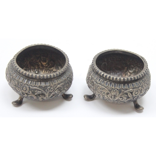 1016 - A pair of Indian embossed silver salts, unmarked but XRF tests approx 91% silver, approx 77.63g gros... 