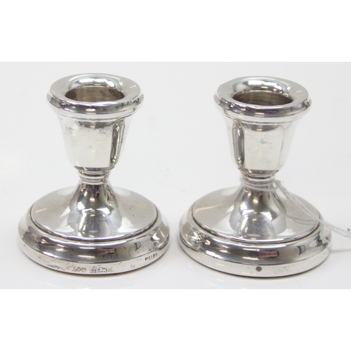 1038 - A pair of dwarf silver candlesticks, each approx 5.5cm tall, Birmingham 1979 by Laurence R Watson & ... 