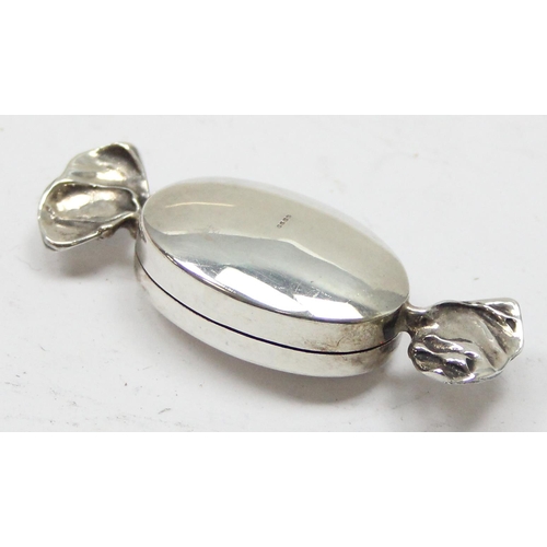 1043 - A small silver pill box formed as a sweet, import marks for Birmingham 1997, approx 11.54g gross