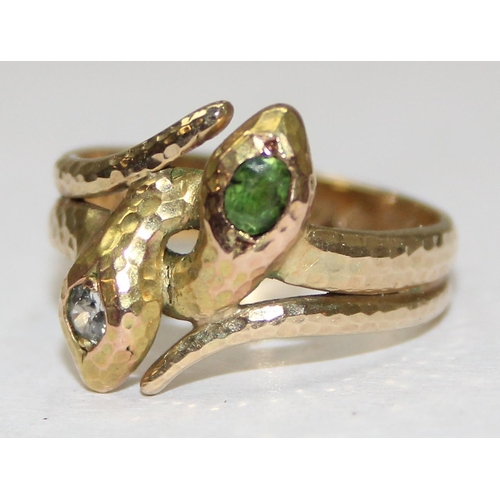 1102 - An unusual 14ct gold ring formed as 2 entwined snakes, one with diamond set head and the other with ... 