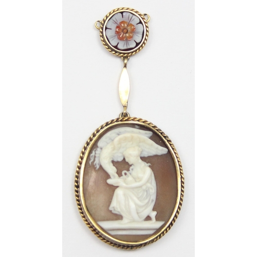 1104 - A 9 carat gold mounted cameo shell brooch, depicting Hebe feeding the Eagle of Zeus, in a beaded ova... 