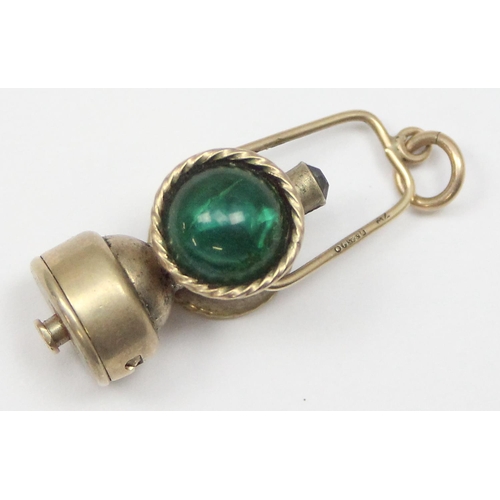 1106 - An unusual 9ct gold charm formed as a railway lamp, London 1964, approx 7.72g gross