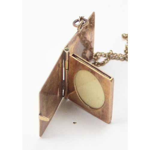 1108 - 9ct gold locket pendant formed as a book, on 9ct gold chain, London 1957, chain approx 38cm long, ap... 