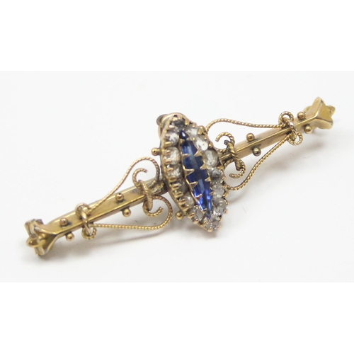 1125 - A late 19th or early 20th century 9ct gold bar brooch set with central blue stone surrounded by whit... 