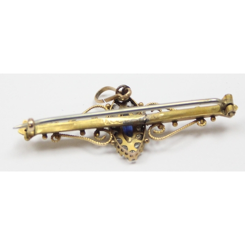 1125 - A late 19th or early 20th century 9ct gold bar brooch set with central blue stone surrounded by whit... 