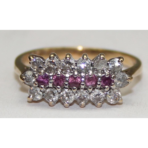 1129 - A 9ct yellow gold ring set with rubies and white stones, approx size L 1/2, approx 2.25g gross