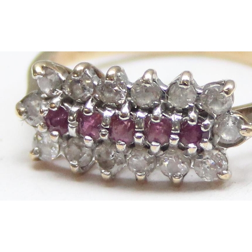 1129 - A 9ct yellow gold ring set with rubies and white stones, approx size L 1/2, approx 2.25g gross