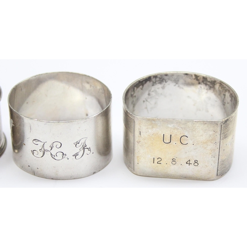 1062 - 5 assorted silver napkin rings, various dates and makers but all with full English hallmarks, one be... 