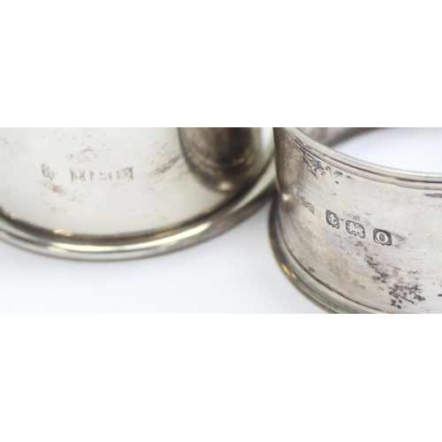 1062 - 5 assorted silver napkin rings, various dates and makers but all with full English hallmarks, one be... 