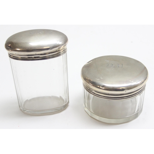 1063 - 2 antique silver topped and cut glass jars, London 1909 Asprey & Co, approx 82.31g gross (without gl... 