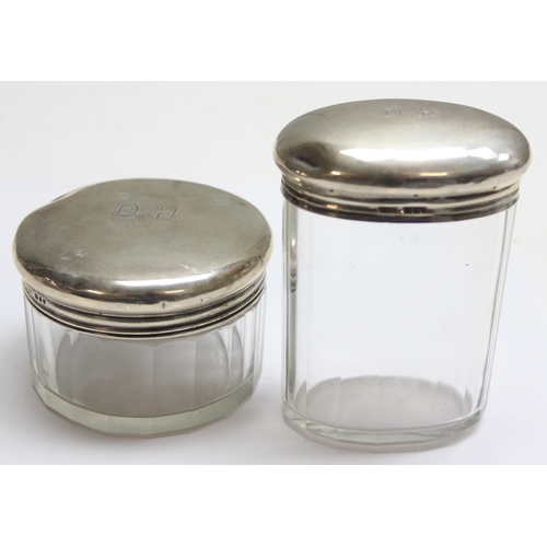 1063 - 2 antique silver topped and cut glass jars, London 1909 Asprey & Co, approx 82.31g gross (without gl... 