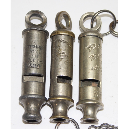 1446 - 3 early 20th century Metropolitan police whistles, an armband and a Metropolitan Special Constabular... 