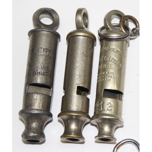 1446 - 3 early 20th century Metropolitan police whistles, an armband and a Metropolitan Special Constabular... 