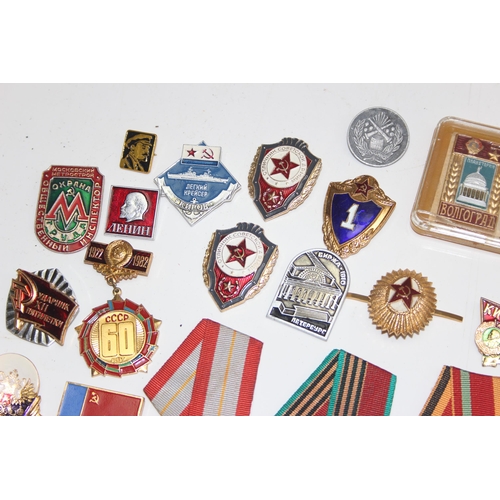 1447 - Qty of assorted Russian or Soviet medals, badges and insignia etc