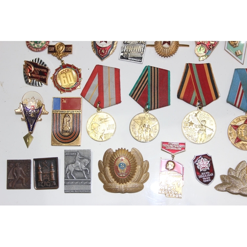 1447 - Qty of assorted Russian or Soviet medals, badges and insignia etc