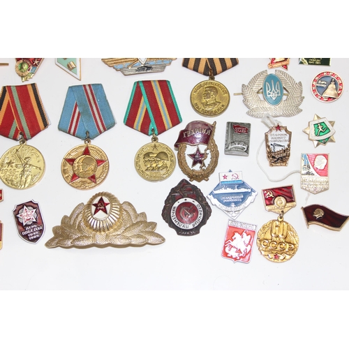 1447 - Qty of assorted Russian or Soviet medals, badges and insignia etc