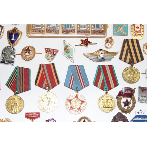 1447 - Qty of assorted Russian or Soviet medals, badges and insignia etc