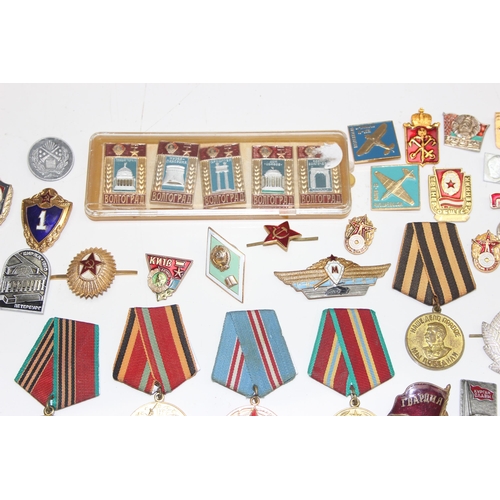 1447 - Qty of assorted Russian or Soviet medals, badges and insignia etc