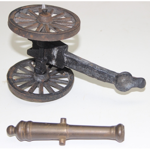 1650 - A miniature vintage brass and iron model of a canon on wheels, approx 20cm wide